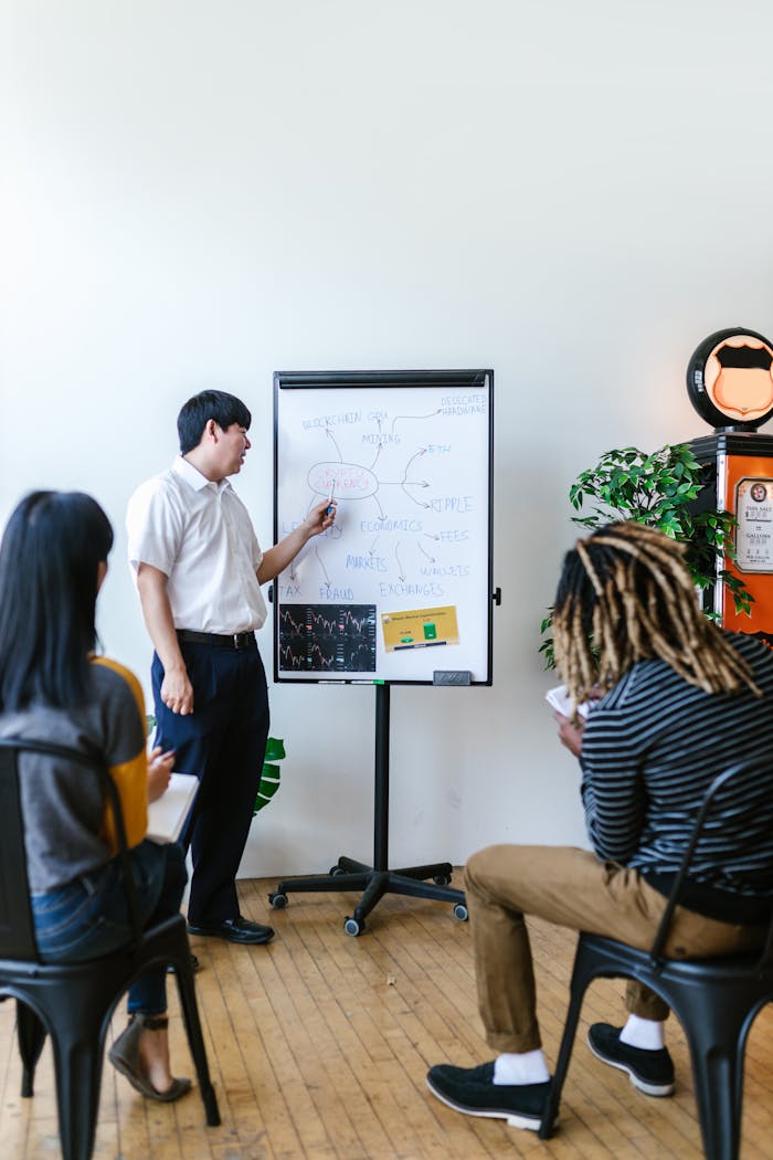 services-06 Trainer giving a presentation on blockchain concepts to a diverse group in a modern office.